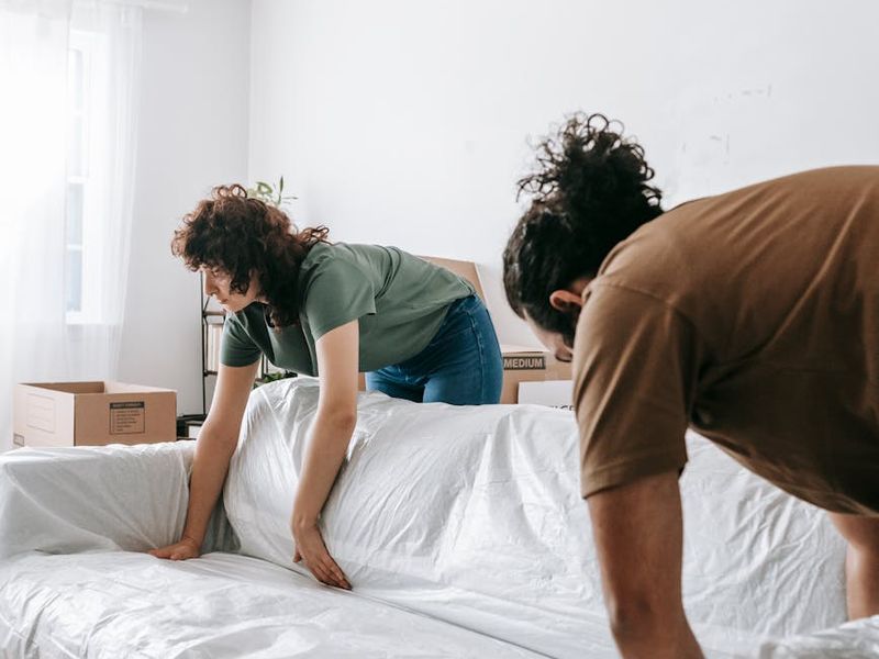 Person moving gracefully in a spacious, minimalist room.